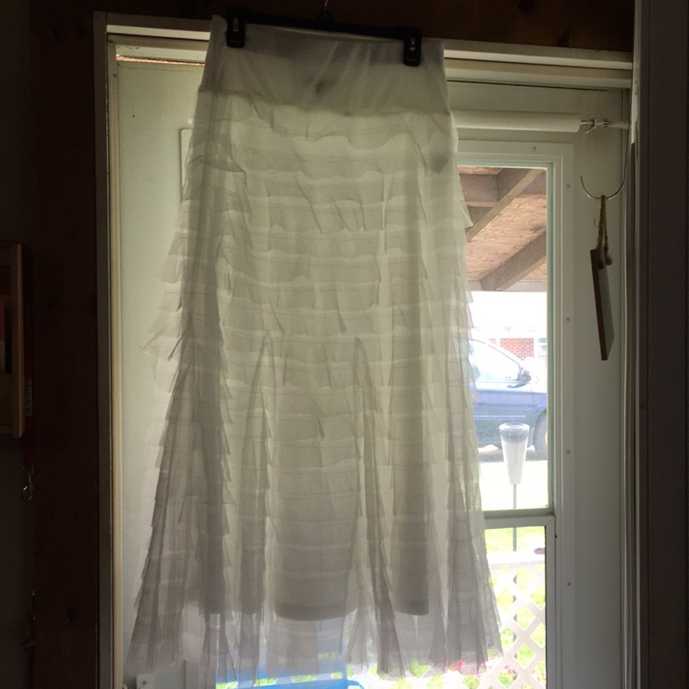 A white ruffle tulle long skirt